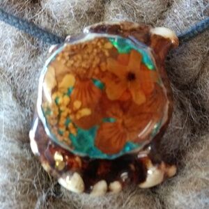 Dried flowers in resin pendent on cord handmade